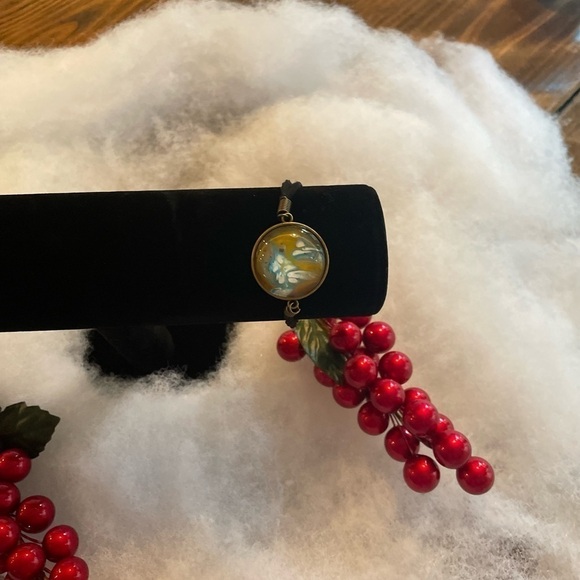 Hand painted acrylic design on glass bracelet. Attached to metal. Adjustable - Picture 2 of 3